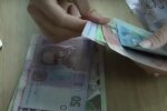 Деньги. Фото: скриншот YouTube-видео